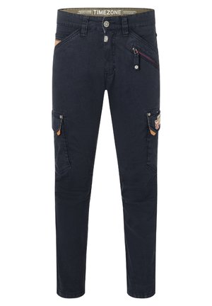 Marineblaue Cargo-Hosen mit schlanker Passform, ausgestattet mit mehreren Taschen, einer Reißverschlusstasche und kontrastierenden sandfarbenen Akzenten. Material aus Baumwollmischung.