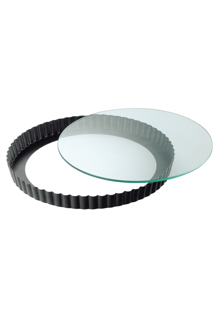 Runde Glasplatte mit einem schwarzen, gerippten Silikonfuß, entworfen für Tarts oder Quiches. Klarglas, glatte Oberfläche, kontrastierender strukturierter Fuß.