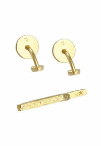Brass wall hooks with rounded bases and curved arms, accompanied by a flat gold bar with a textured surface. Both components are shiny gold.