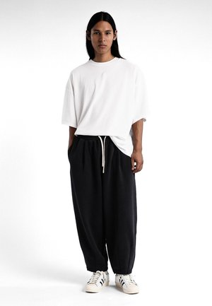 ICONIC BALLOON - Pantalon de survêtement - black