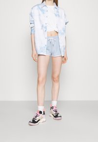 Ellesse Teplákové kalhoty - light blue