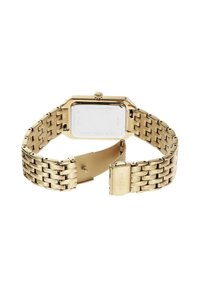 Montre bracelet en acier inoxydable doré avec un cadran rectangulaire, une finition métallique et une fermeture à boucle. Le dos présente une gravure de la marque.
