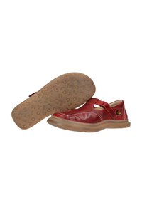 Red leather shoes featuring a cross-strap, rounded toe, and contrasting white stitching. Brown rubber sole with embossed letters.