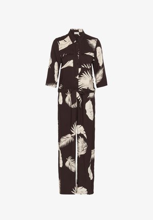 Tuta nera con stampa di foglie tropicali beige, chiusura frontale con bottoni, tasche sul petto, maniche a tre quarti e cintura da annodare in vita.