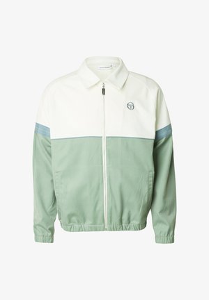Giacca con zip bianca e verde salvia, collo, polsini ed orlo elasticizzati, logo sul petto a sinistra e dettagli a strisce blu sulle maniche.