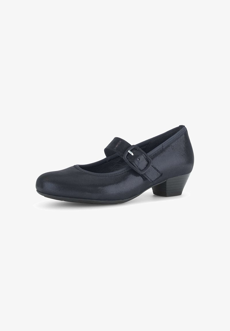 Chaussures Mary Jane noires avec un bout rond, un petit talon bloc et une sangle sur le cou-de-pied maintenue par une boucle. Texture lisse.