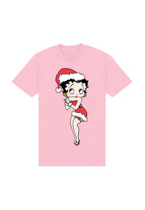 Lyserød t-shirt med korte ærmer, der viser en tegneseriefigur i en rød kjole og julemands hat, med hvid kant og sort hår; legende design.