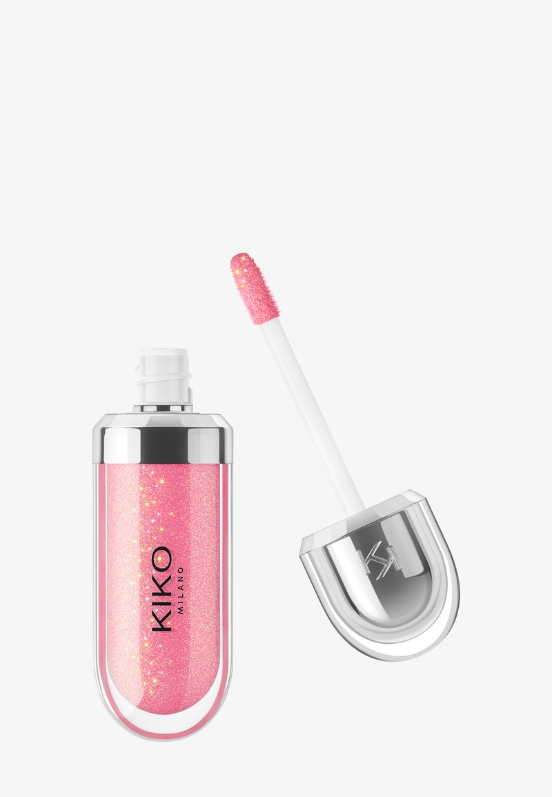Glossy pink glitter lip gloss with silver cap and built-in applicator wand beside the open tube on a white background.