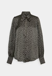 Blusa negra con pequeño estampado floral en crema, de mangas largas y con botones en la parte delantera. Fabricada en tejido ligero; cuenta con un cuello.
