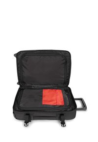 Black suitcase with a zipper, open to reveal a lined interior. Features a red accent pocket and a retractable handle. Smooth texture.