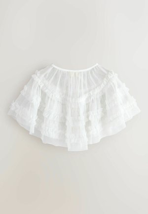 Valge tüllseelik kihiliste volangidega, millel on pehme, läbipaistev tekstuur. Ümar disain koos kogutud vöökohaga, sobib erinevatele istuvustele.