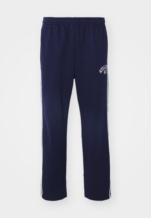 Navy blue sweatpants with an elastic waistband, white side stripes, and embroidered text on the left leg. Made from soft, breathable fabric.