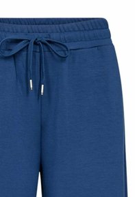 Blauwe sweatpants met elastische tailleband en verstelbaar trekkoord met metalen aglets, gemaakt van zachte stof.
