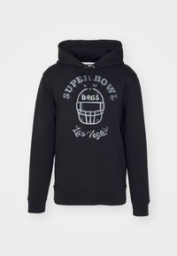 Sweat à capuche noir avec poche avant, texte gris "SUPER BOWL", illustration de casque de football, inscriptions "BOSS" et "Las Vegas" sur la poitrine.