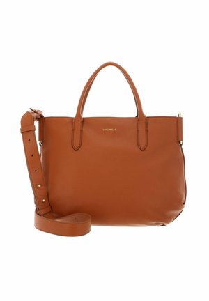 Tan leather handbag with two top handles, adjustable shoulder strap, and small gold brand logo on the front center.