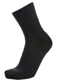 Calcetín negro de canalé con longitud hasta la mitad de la pantorrilla, con una textura suave y puntera reforzada. El tejido parece elástico y duradero.
