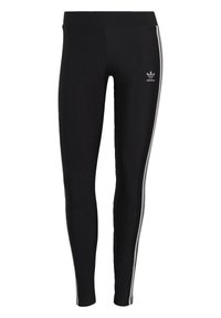 Mustat leggingsit joustavasta kankaasta, joissa on valkoiset sivupainatukset ja pieni logot vasemmassa reidessä. Silkkinen pinta, istuva muotoilu.