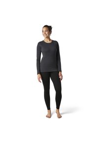 Langsleeve donkergrijs top met een ronde halslijn en raglanmouwen, gecombineerd met zwarte leggings. Zachte textuur, getailleerd ontwerp.