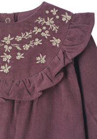 Purple corduroy dress with a ruffled collar, featuring gold floral embroidery and a back button closure. Soft texture, ribbed pattern.