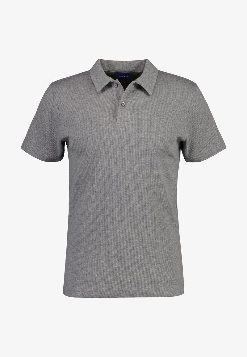 Polo shirt gris à manches courtes en tissu texturé, avec un col et une patte de boutonnage à deux boutons. Logo de la marque discret sur la poitrine.