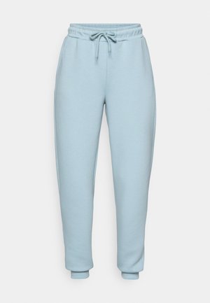 Hellblaue Sweatpants aus weichem Material. Sie verfügen über einen elastischen Bund mit Kordelzug, sind tapered geschnitten und haben gerippte Bündchen an den Knöcheln.