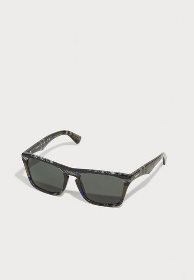 Black and blue patterned sunglasses with dark lenses, rectangular shape, wide frames, and straight temple arms. Durable plastic material.