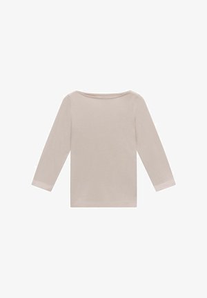 Vaalea beige pitkähihaisessa paidassa on leveä kaula-aukko. Se on valmistettu pehmeästä kankaasta, ja siinä on yksinkertainen, saumaton muotoilu sekä suora helma.