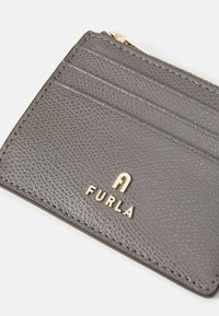 Gray textured leather cardholder with three card slots and gold Furla logo on a white background.