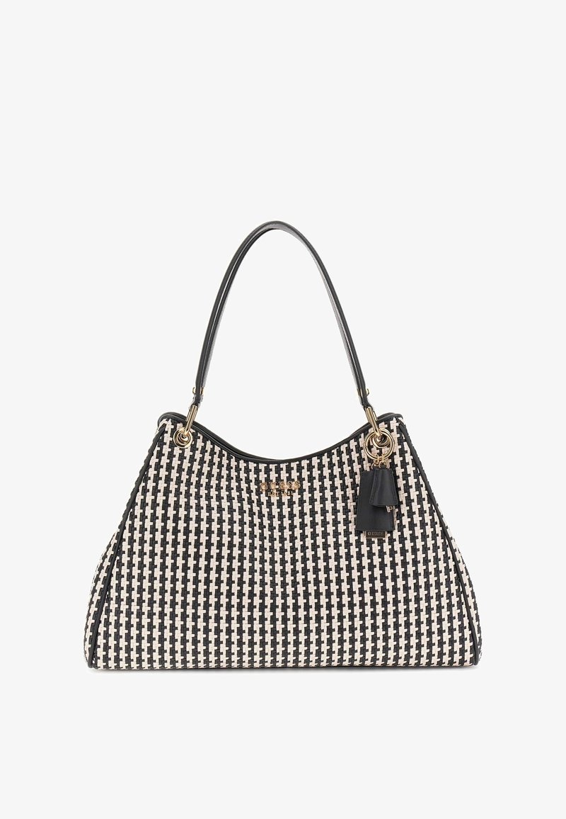 Sac à main tissé en noir et blanc avec une forme hobo, doté de quincaillerie dorée, d'un gland accent noir et de doubles poignées.