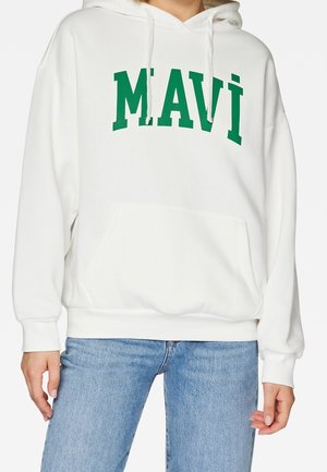 Sweat à capuche blanc avec texte vert ""MAVI"", poche avant et cordons, porté avec un jean bleu clair par une personne.