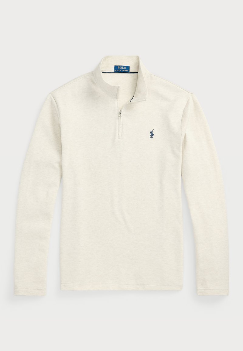 Helebeige pikkao termomehhanikuga pullover, millel on pool tõmblukk krael. Ees on väike tumesinine logo rinnal. Pehme, tekstuuriga kangas, juhuslik sobivus.