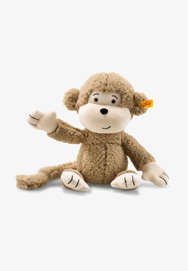 Light brown plush monkey toy with a textured, furry body; round face; embroidered features; and soft limbs. Waving hand gesture.