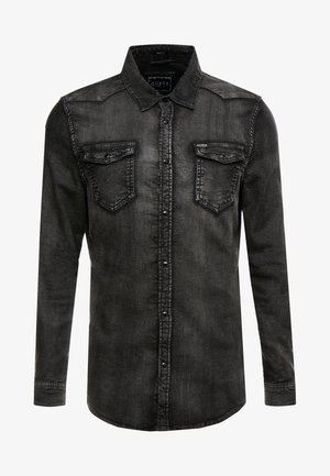 Sort denim langærmet skjorte med knaplukning, to brystlommer med klap og krave, der viser en let falmet tekstur.