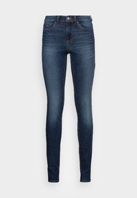 Smaljeans i mørkt denim med en lett falming. Har et klassisk fem-lommers design, knappelukking og smale benåpninger.