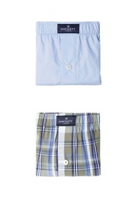Boxers en coton bleu clair avec fermeture à boutons et ceinture élastique, associés à des boxers à carreaux verts et bleus, tous deux de la marque Hackett.