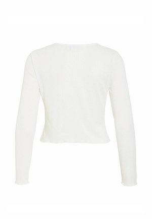 Haut blanc à manches longues ajusté avec un col rond et un ourlet légèrement évasé, présenté de dos.