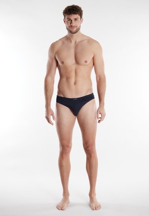 Black cotton briefs with a comfortable waistband, featuring a minimalist design and smooth texture. Suitable for everyday wear.