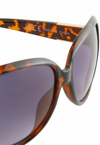 Next POLARIZED brązowy