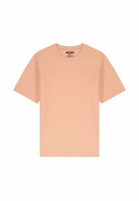 Šviesiai persikų spalvos trumpomis rankovėmis marškinėliai, pagaminti iš švelnios medvilnės, su apvaliu kaklu ir paprastu dizainu, be jokių raštų ar akcentų.