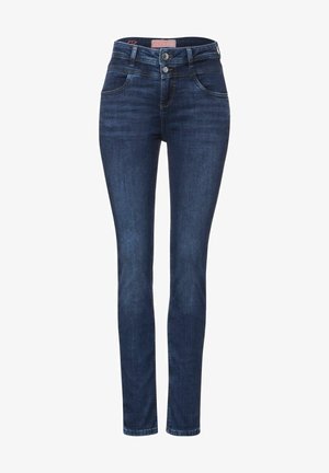 Jean skinny en denim bleu foncé avec une texture lisse, taille haute, cinq poches et fermeture à double bouton. Coupe ajustée au niveau des jambes.