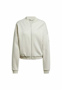 Ljust beige kort bomberjacka med framdragkedja, ribbat krage, cuffs och midja på vit bakgrund.