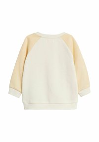 Sweatshirt avec un corps crème et des manches raglan jaune clair. Présente un col et des poignets côtelés, fabriqué en mélange de coton doux.