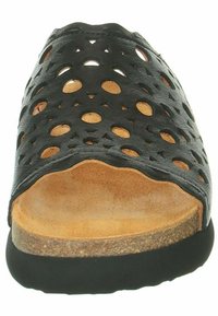 Schwarze Leder-Sandalen mit offenen kreisförmigen Designs, einer natürlichen Leder-Innensohle und einer strukturierten Gummisohle. Flaches Design.