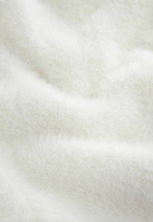 Balta, puri medžiaga su minkštu, tekstūruotu paviršiumi. Medžiaga pasižymi lengvu, oro prisotintu pojūčiu su nedideliais gylio skirtumais.