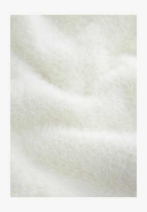 Tessuto bianco e morbido con un aspetto soffice e testurizzato. Il materiale presenta una qualità leggera e ariosa con sottili variazioni di profondità.