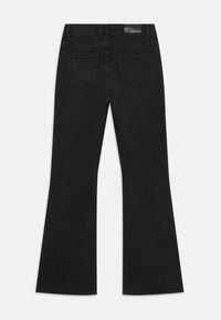 Black flared jeans with a smooth texture. Featuring two back pockets and a waistband label. Simple design, no embellishments or patterns.