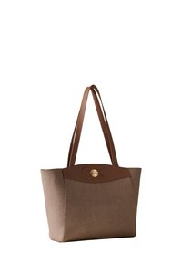 Brown textured tote bag with two shoulder straps, a smooth top panel, and a circular gold hardware detail on the front.