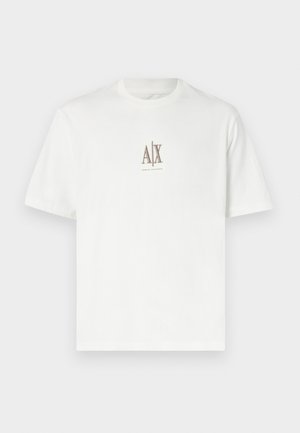 T-shirt de algodão branco com decote redondo. Apresenta um pequeno logótipo bege "A|X" e "ARMANI EXCHANGE" impresso abaixo. Mangas curtas, corte regular.