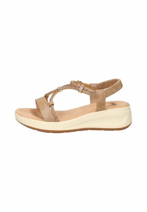 Sandalo con zeppa beige con cinturino elastico sul retro, cinturini laterali decorativi, soletta imbottita e suola bianca per uso quotidiano.