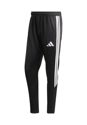 Czarne spodnie sportowe o zwężanym kroju, z trzema białymi paskami po bokach i logo adidas na lewej udzie.